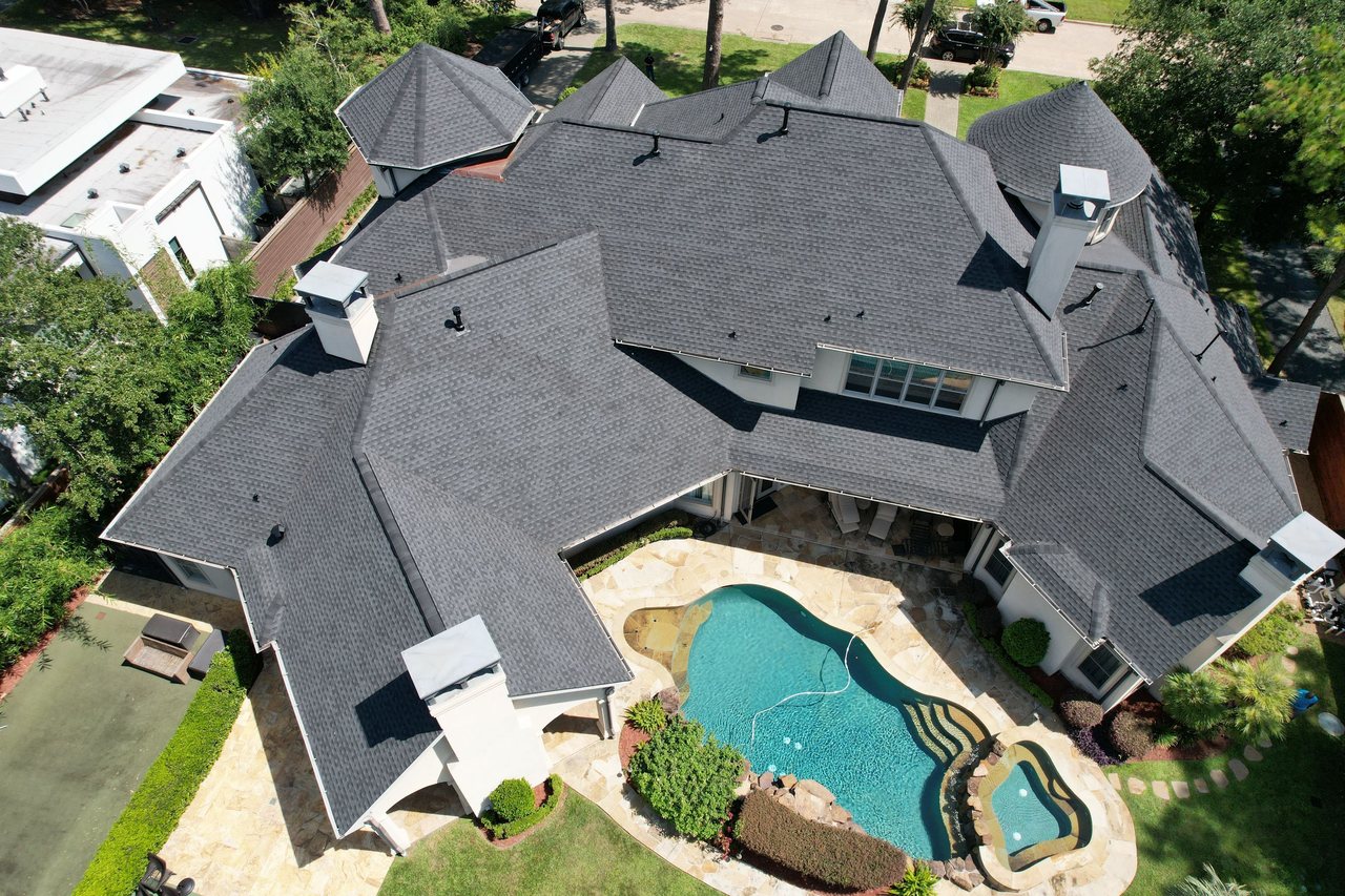 Completed asphalt shingle roof replacement on a large Katy, TX home