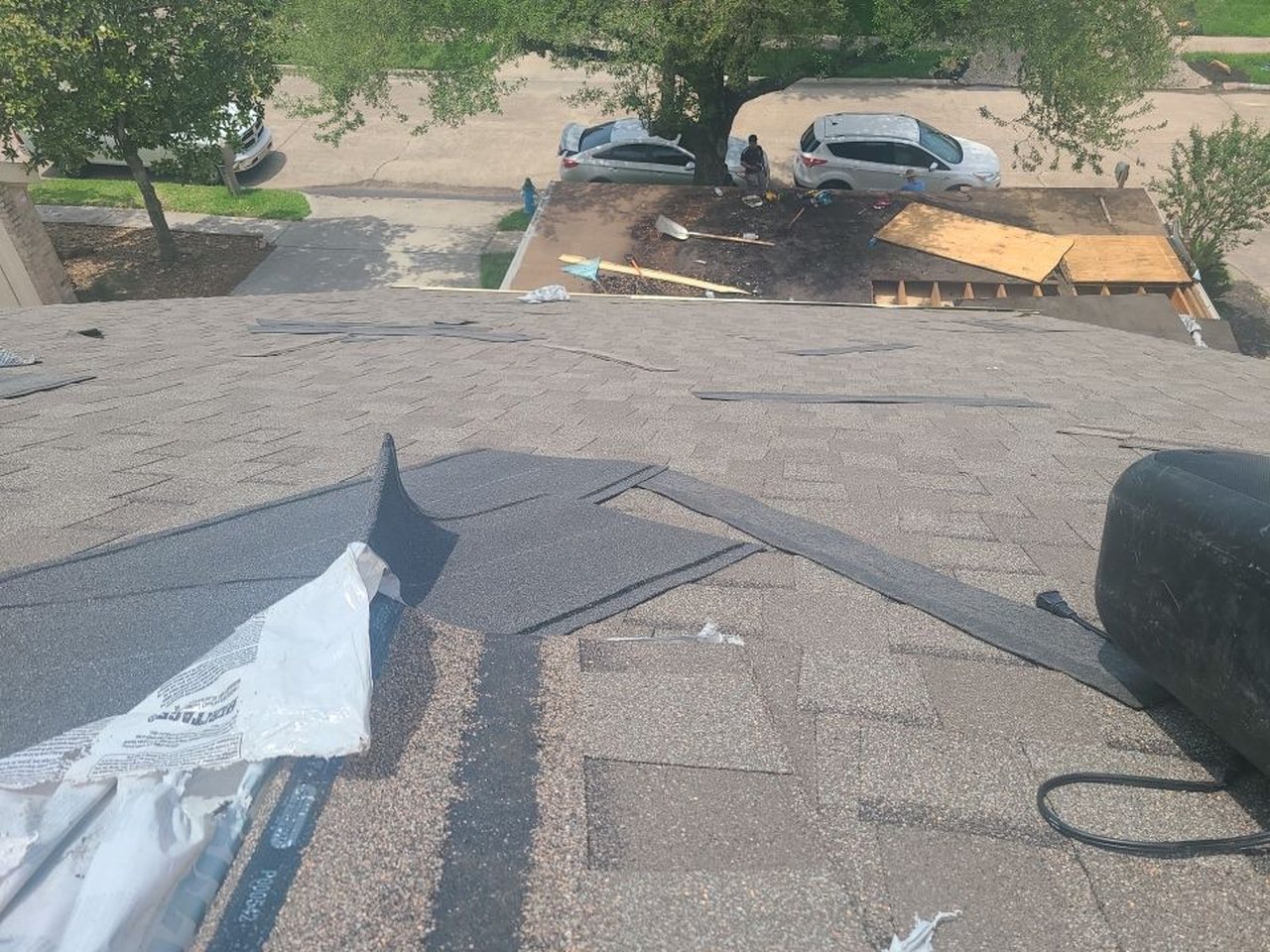 Routine roof maintenance check on a Katy-area home